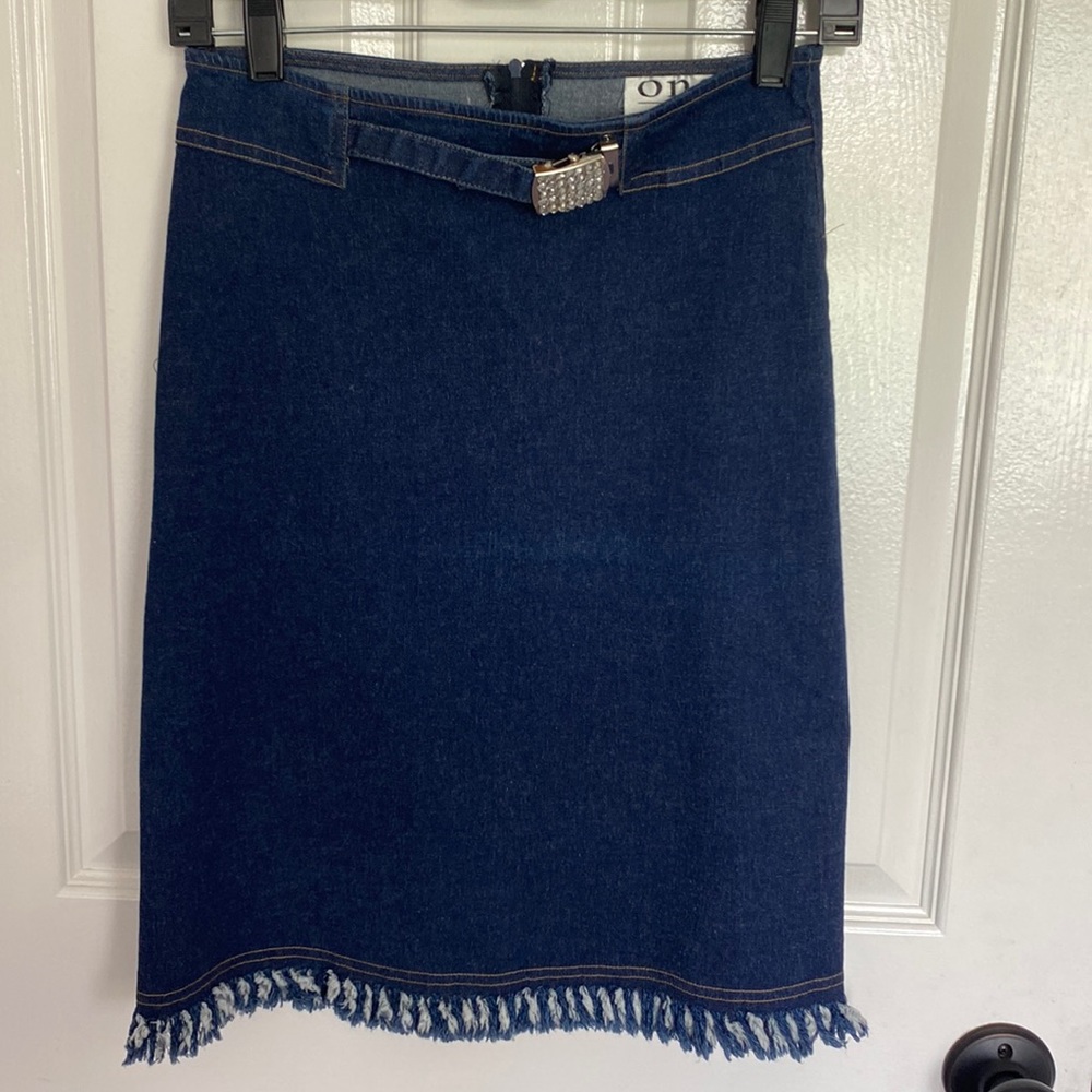 Denim skirt. Fringe hem.Dark wash. Stretchy denim. Size small. Soooo cute!